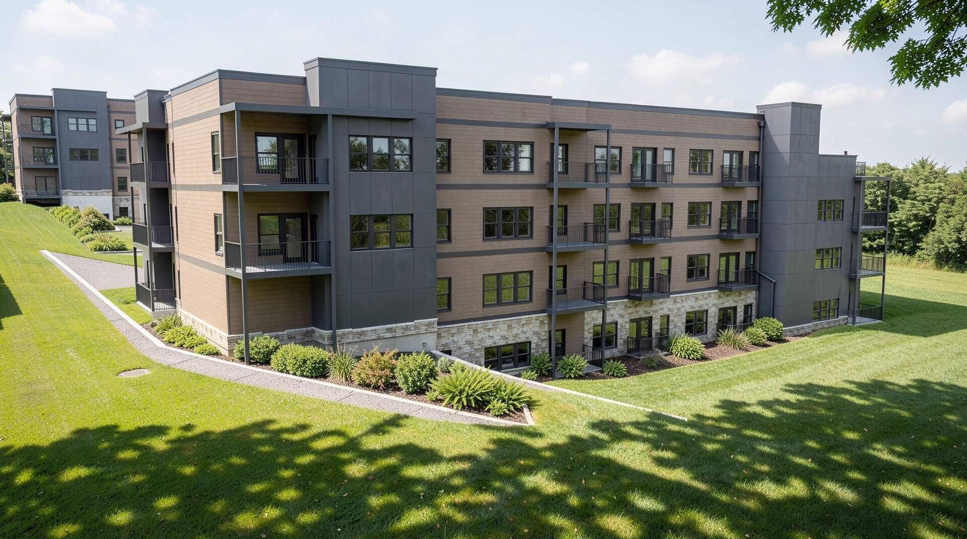 Rendering of The Rio Apartments across the lawn, showing balconies and stone base