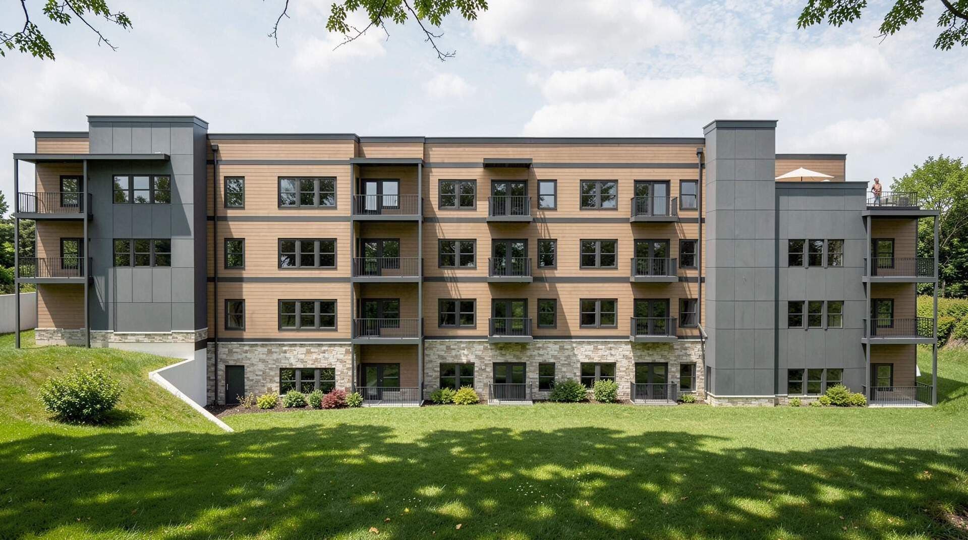 Rendering of The Rio Apartments rear elevation and open lawn
